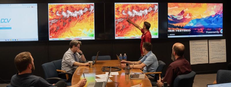 Group discussing visualizations of satellite data