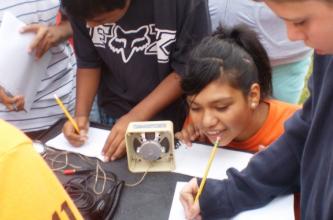 Listening to the satellite beacon. Students record telemetry  from ARISSat.