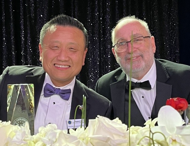 John Moore (right) talks with Howard Hu